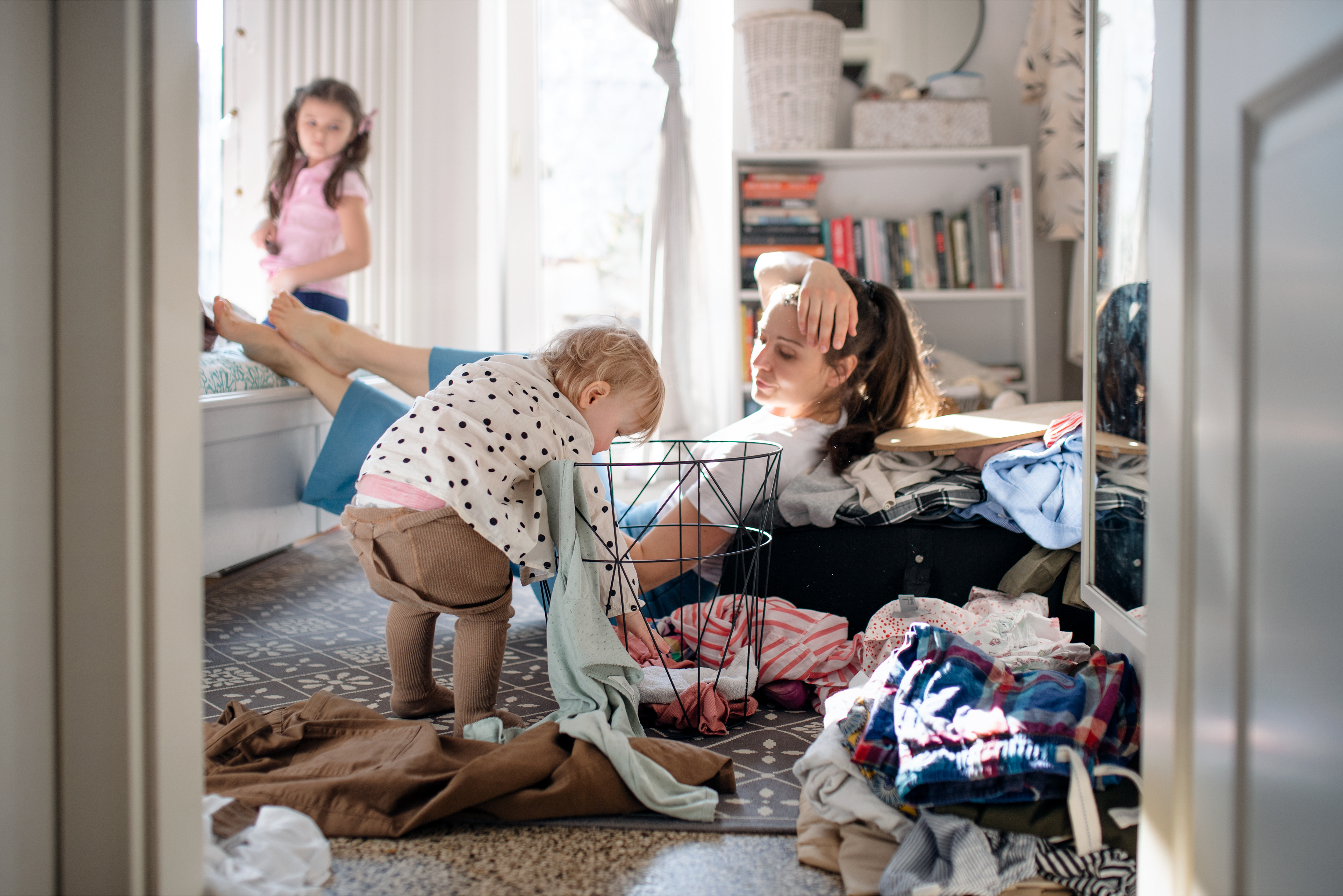Stressed Mom with kids on the floor.
