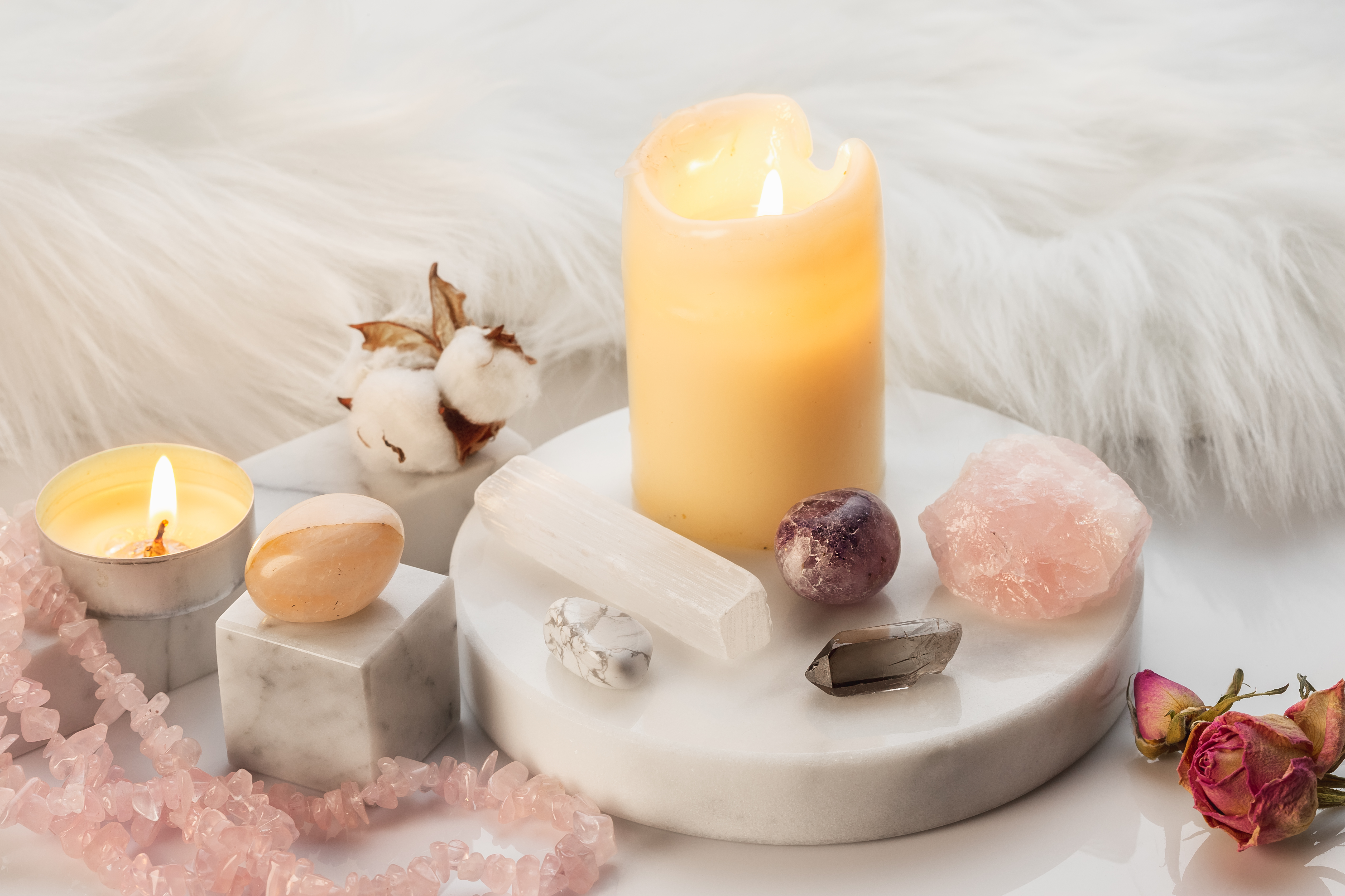 Candles and crystals on a granite block